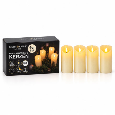 Set aus vier cremefarbenen led echtwachskerzen mit realistischem flammeneffekt für adventskranz und dekoration