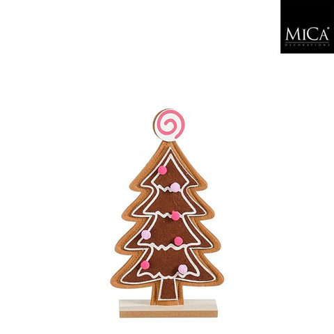 Ein brauner pfefferkuchen weihnachtsbaum mit rosa und weißen zuckerverzierungen und zuckerstangen toppers