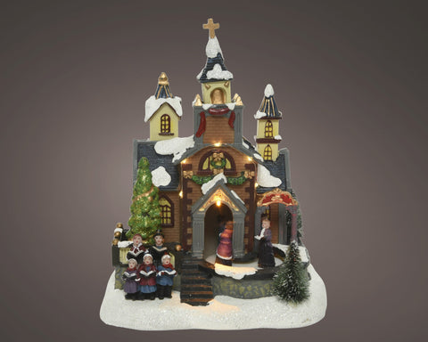 Led szene kirche weihnachtliche miniatur mit warmweißen led-lichtern, verschneitem dach und bunten fenstern