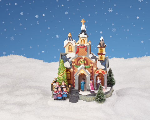 Detaillierte led szene weihnachtskirche mit warmweißen led leuchten schneebedeckte dächer und festlichem kranz