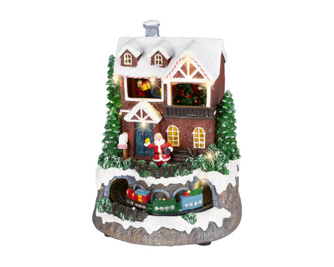 Led szene kleiner zug mit warmweißen leds zeigt weihnachtliches haus mit rotem santa, schneebedecktem dach und miniature zug