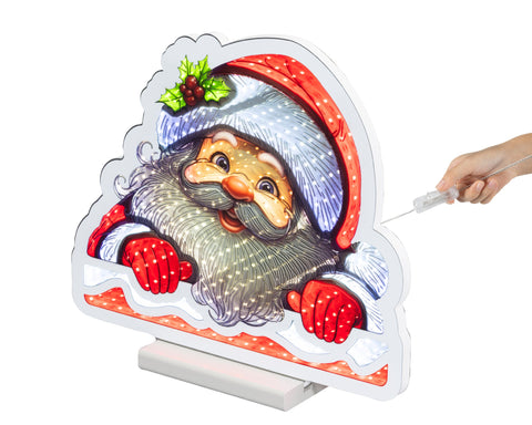 Ein festlicher LED infinity santa bunt santa claus mit rotem und weißem hut, holly-beeren, bart und handschuhen auf standfuß