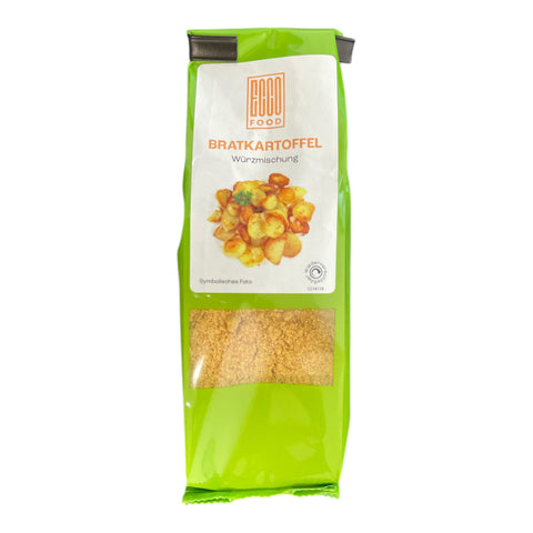 Grün-weißes paket baco bratkartoffel würzmischung 80g mit durchsichtigem fenster und goldbrauner gewürzmischung