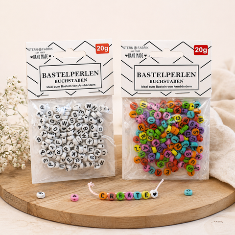 Zwei pakete bunter buchstaben bastelperlen von stern fabrik aus kunststoff zum gestalten mit 20g gewicht