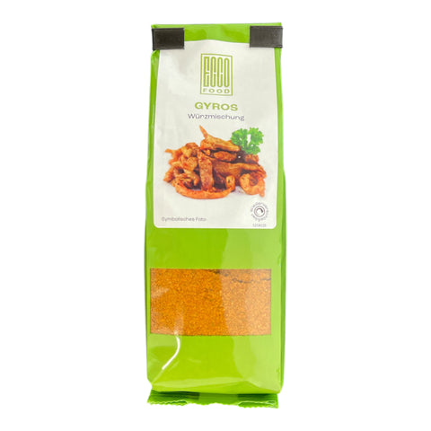 Grüne bag of gyros würzmischung 80g von caco food mit durchsichtigem fenster und braunem gewürz innen