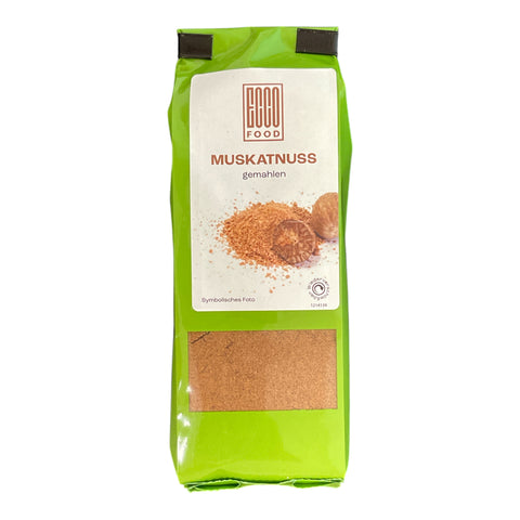 Hellgrüne verpackung von coco food gemahlene muskatnuss im praktischen dosierbeutel