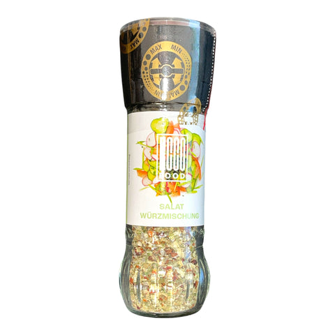 Ein klarer glasgewürzmühlen mit einer bunten salat würzmischung von mood food mit schwarzem deckel und weißem etiket