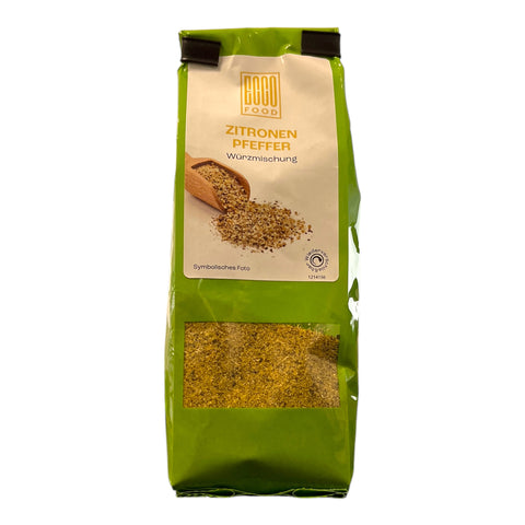 Grüne verpackung der good food zitronenpfeffer 50g mit durchsichtigem fenster zeigt gelblich-grüne granulate