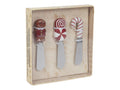 Set aus drei festlichen keramik käsemessern mit lebkuchendeko in form von lebkuchenmann, zuckerwatte und zuckerstange