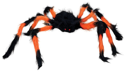 Eine plüschige schwarz-orange spinne 75 cm mit flauschigen beinen und leuchtend roten augen
