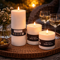 Drei weiße zylindrische led outdoor solar kerzen mit schwarzen stern fabrik etiketten für garten und terrasse