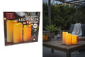 Set aus drei led-outdoorkerzen mit warmem gelb-orangefarbenem licht, batteriebetrieben für innen und außen