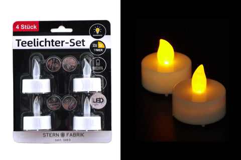 Set aus vier weißen led teelichtern mit flammenähnlichem gelblichen leuchten und timerfunktion