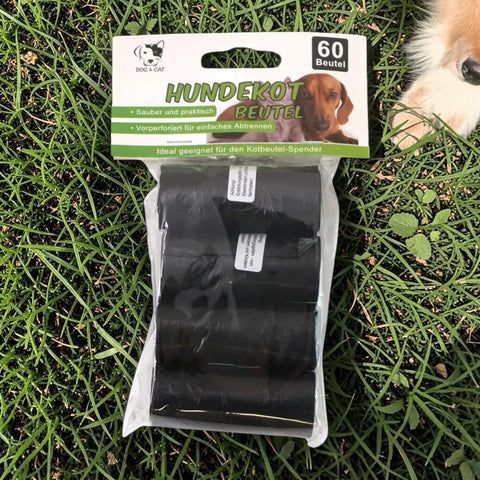 Schwarze hundekotbeutel aus kunststoff in transparenter packung mit grün-weißer beschriftung 60 stück