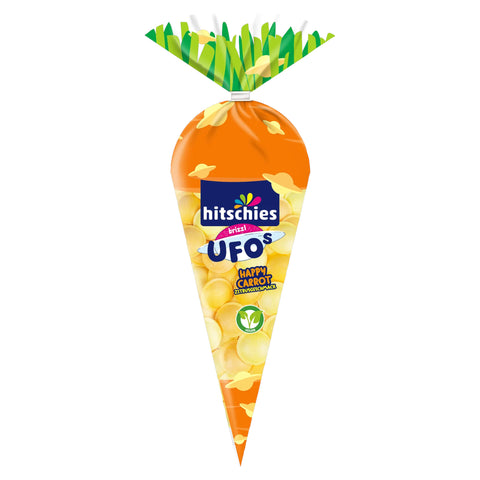 Orange karottenförmige hitischies ufos happy carrot zitrus bonbonverpackung mit grüner blattspitze und gelb-orange farbenen süßigkeiten