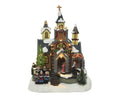 Christmas-themed miniature LED church figurine with warm white lights snow-dusted roof and choir figures 13x18x24cm