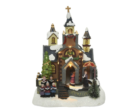 Christmas-themed miniature LED church figurine with warm white lights snow-dusted roof and choir figures 13x18x24cm