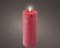 Led kerze wachs in rot mit strukturierter oberfläche und leuchtender flamme für dauerbetrieb indoor