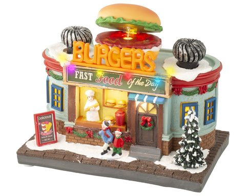 Ein festliches miniatur burgerladen modell mit warmweißen led-lichtern, schneebedecktem dach und leuchtendem burgers schild