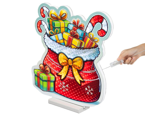 Led infinity geschenktasche klein bunt mit rot-weiß gepunkteter weihnachtsstrumpf beleuchtung und goldschleife