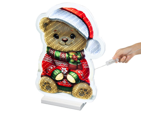Ein festlicher led infinity bär bunt 1.3x25.5x36cm mit rotem und silbernem santahut und gemustertem rot-grünem pullover