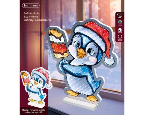 Ein festlicher blauer led infinity pinguin mit rotem weihnachtsmütze und weißen punkten hält ein eis am stiel