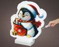Led infinity pinguin warmweiße led beleuchtung mit schwarzem weißem cartoon pinguin und leuchtendem geschenksack