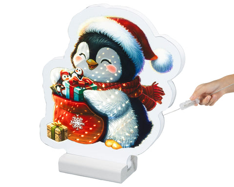 Led infinity pinguin festliche beleuchtung warmweiße leds schwarz weiß mit rotem santa hut und leuchtendem geschenkesack
