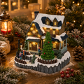 Ein charmantes miniatur weihnachtshaus led szene mit schneebedecktem dach, dunklen blauen schindeln und warmen leuchten