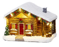 Festliche beleuchtete schneehütte figurine mit schneebedecktem dach und roter tür in warmweißer led szene