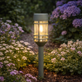 Solarfackel retro-birne olivgrün mit mattem grau und klaren glasplatten um beleuchtete birne