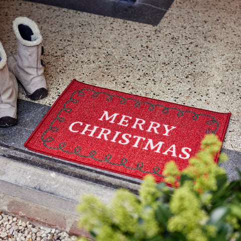 Roter glitzernder fussmatte aus nylon 40x60x0,5 cm mit weißem merry christmas schriftzug und schwarzem rahmen
