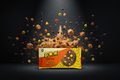 Bunte reese´s boom gebäckverpackung in orange und gelb mit schokoladenkeks und bunten bonbonstücken 15g