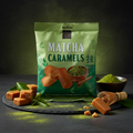 A vibrant green package of matcha caramels 175g with glossy finish and elegant leaf motifs