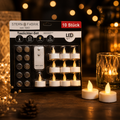 Set aus zehn weißen led-teelichtern mit fernbedienung und batterien in schwarzer stern fabrik verpackung