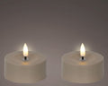 Two cremefarbene led-teelichter mit realistischem flammeneffekt aus braunem kunststoff 7x7x3,2 cm