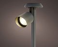 Grauer zylindrischer solar spotlight edelstahl mit warm leuchtender birne und metallischem rand für dauerbetrieb