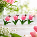 Tischdeckengewicht tulpe 4er set aus pinken tulpenförmigen papierclips mit grünen stängeln und metallclips