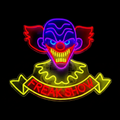 Neonleuchte clown freak show 68x66,5 cm mit leuchtendem clowngesicht in blau, lila, rot und gelbem freak show banner