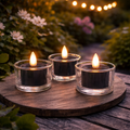 Drei schwarze solar led teelichter mit 3d docht in klaren glas haltern im 3er set