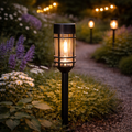 Schwarze solarbetriebene gartenwegleuchte solarfackel retro-birne 48x7 cm mit klarem glas und warm leuchtender birne