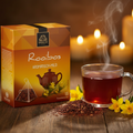 A box of bardollini rooibos aromatisch-mild tea with warm orange and brown geometric design and teapot illustration