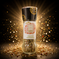 A sleek glass pepper mill with black top and gold accents labeled krauter gewurzsalz by eco food