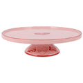 Pink ceramic cake stand with red decorative illustrations of mickey and minnie mouse around a central heart