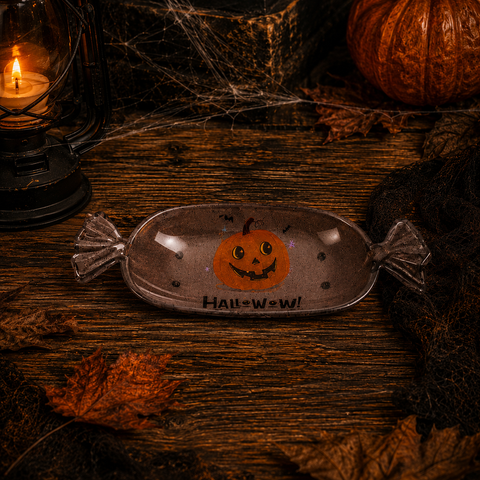 Halloween candyschale klare, bonbonförmige schale mit lächelndem orangefarbenem kürbis und halloween text