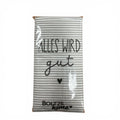 Taschentücher mit spruch featuring a gray and white striped kitchen towel with black cursive text alles wird gut and a small heart in clear plastic packaging