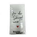 White paper napkin with black cursive text für die schnupfnase and red heart branded boltze home for taschentücher mit spruch