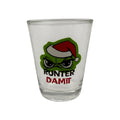 Klarer glass schnapsglas mit grünem cartoon und rotem santa hut mit text runter damit für festtagsmuffel