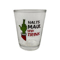 Klarer glas schnapsglas mit grünem grinch hand zeigend den mittelfinger und schwarzem roten text festtagsmuffel