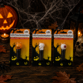 Drei halloween-themed led flaschenkorken in orange, weiß und rot mit schwarzen basen für festliche dekoration